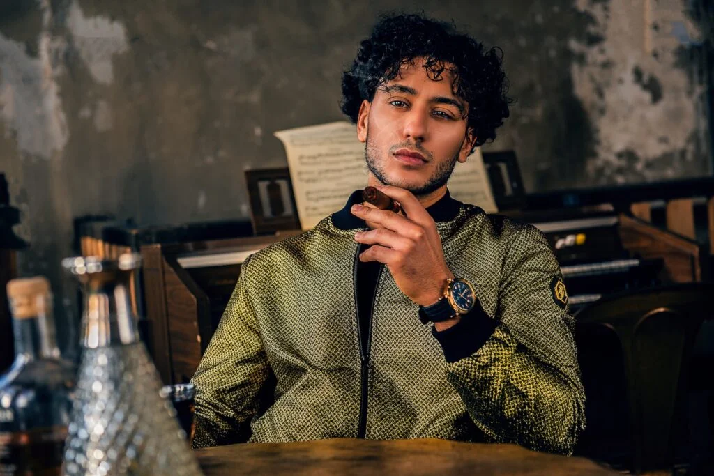 men with curls sitting at desk